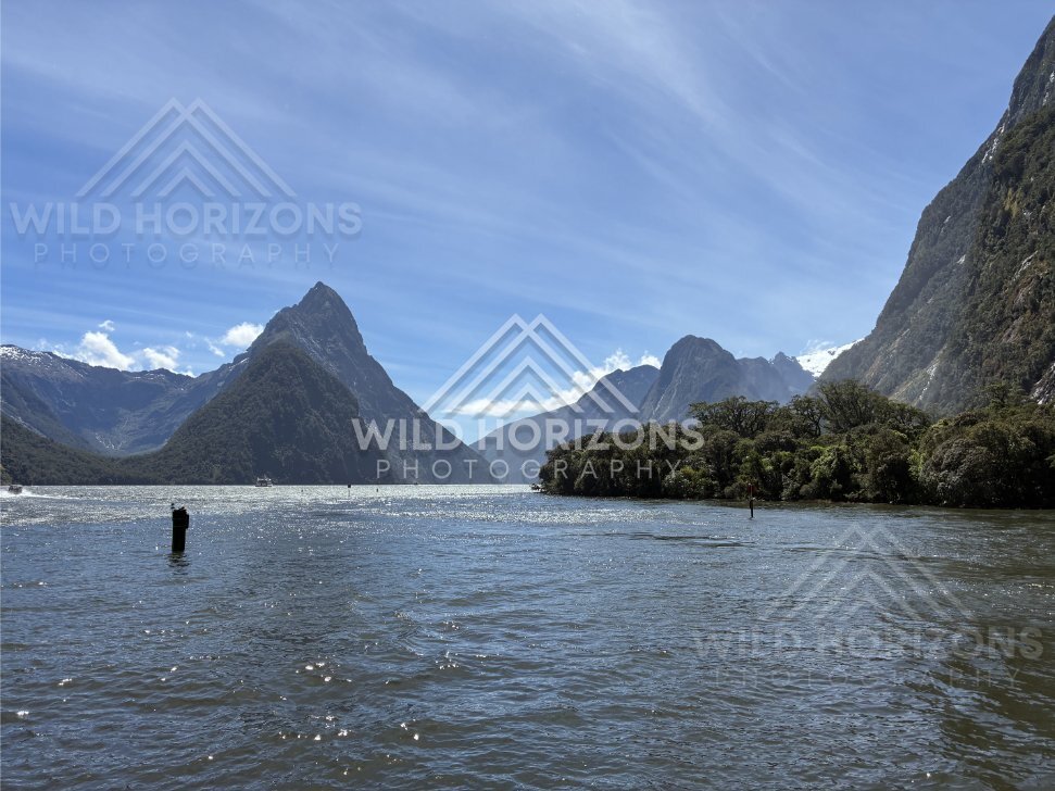 Mitre Peak framed by channel markers, Milford Sound, New Zealand