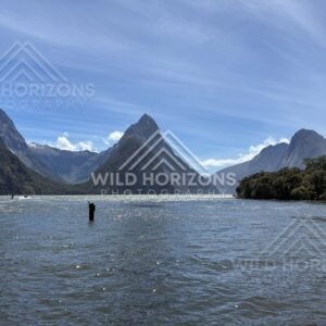 Mitre Peak and fjord entrance with navigation marker, Milford Sound, New Zealand
