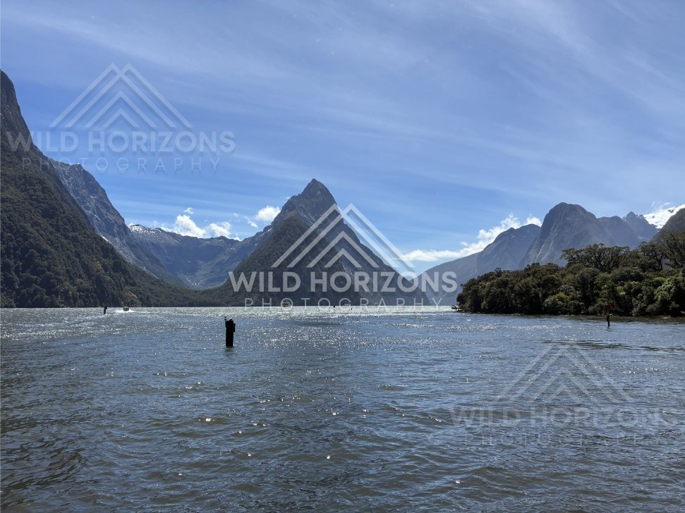 Mitre Peak and fjord entrance with navigation marker, Milford Sound, New Zealand