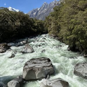 Boulder-Strewn Rapids in Mountain Valley. New Zealand
