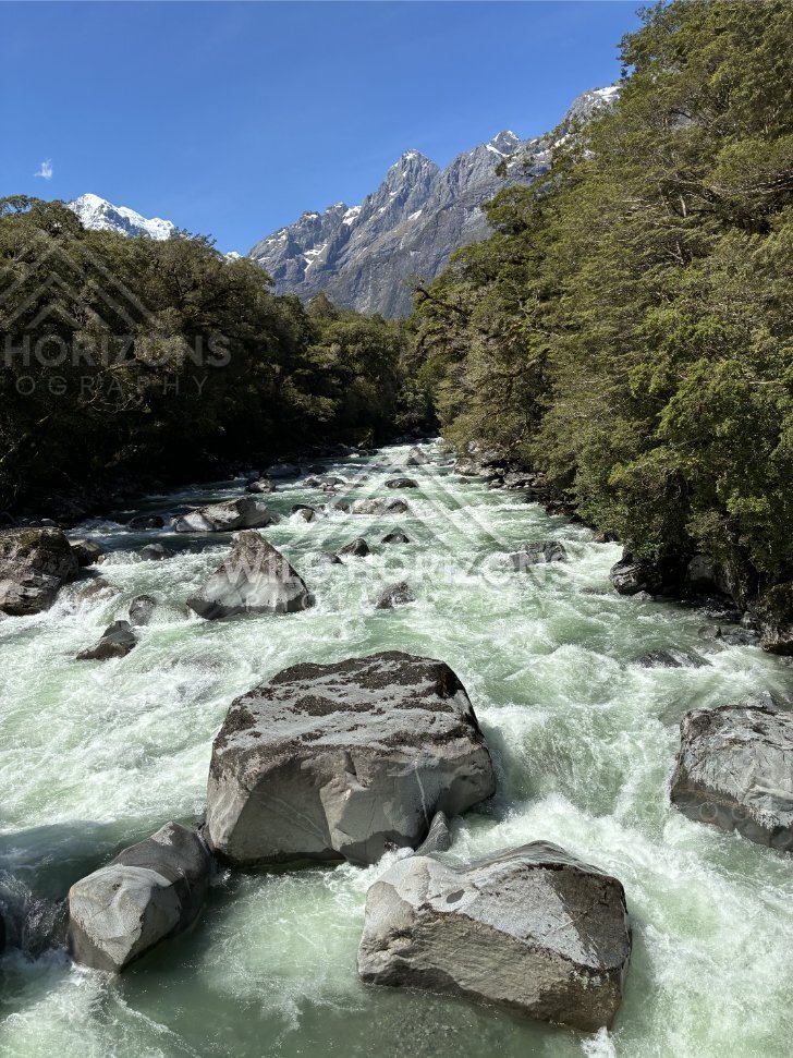Boulder-Strewn Rapids in Mountain Valley. New Zealand