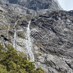 Waterfalls on Steep Cliffs Along Milford Road New Zealand