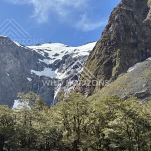Mountain Valley and Snow Patches Along Milford Road New Zealand