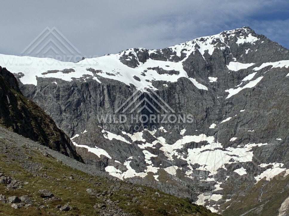 Snow-Streaked Mountain Face on Milford Road New Zealand