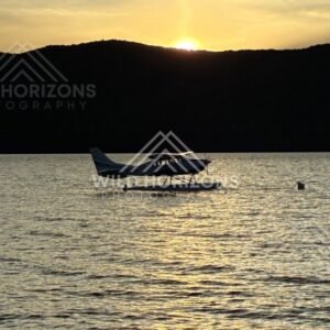 Seaplane Silhouette on Lake Te Anau at Sunset New Zealand