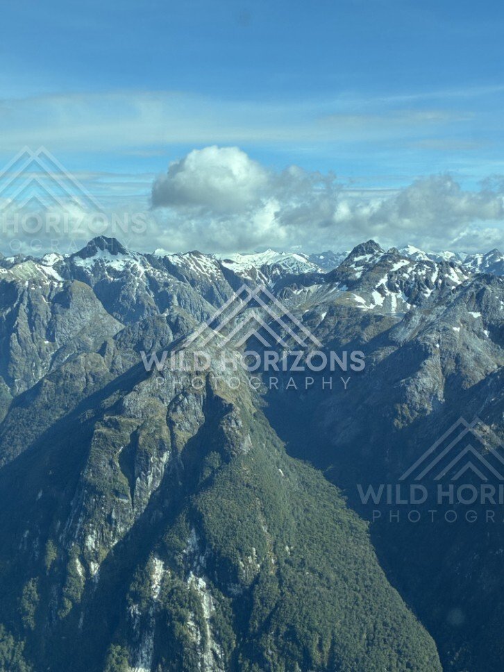 Snow-Dusted Peaks and Fiordland Valleys. Fiordland, New Zealand.