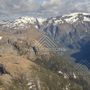 Sunlit Fiordland Ranges and Deep Valleys. Fiordland, New Zealand.