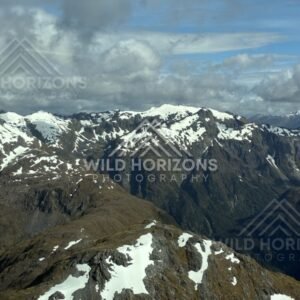 High Fiordland Ridges Under Broken Cloud. Fiordland, New Zealand.