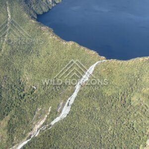 Waterfall and Lake in Fiordland. Fiordland, New Zealand.