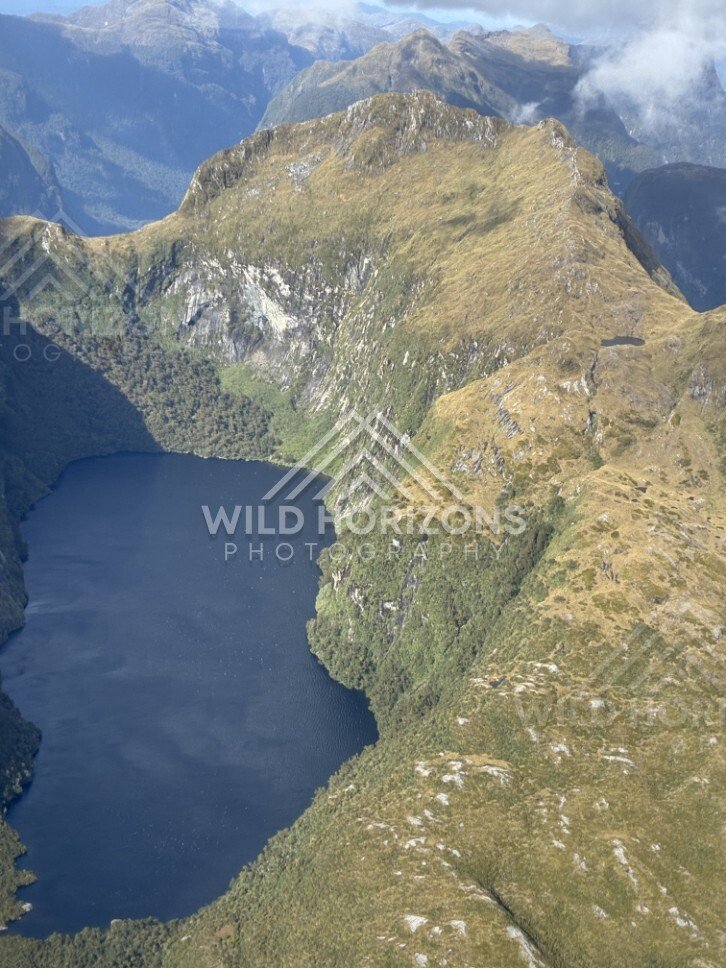 Remote Fiordland Lake Surrounded by Mountains. Fiordland, New Zealand.