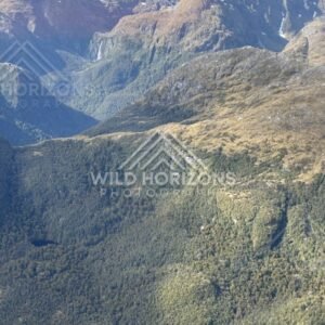 Sunlit alpine ridges and deep valleys. Fiordland, New Zealand.