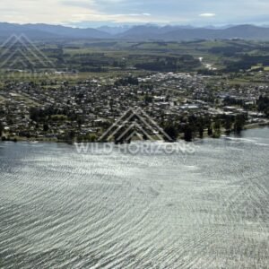 Lakeside township and shoreline seen from above. Manapouri, New Zealand.