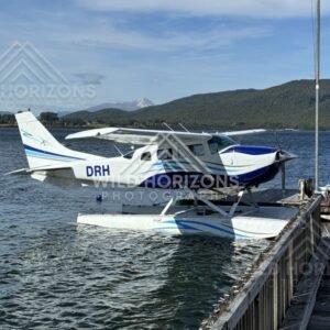 Seaplane moored at jetty on mountain lake. Manapouri, New Zealand.
