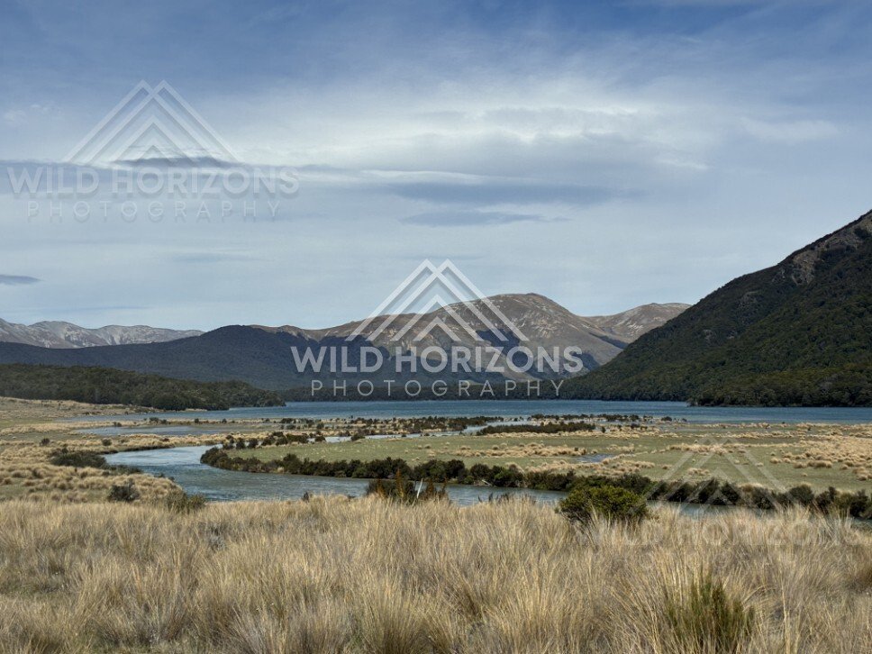 Reflections across still lake and mountain backdrop. Mavora Lakes, New Zealand.