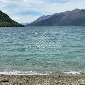 Lakeshore and mountain ridges in clear light. Kingston, New Zealand.