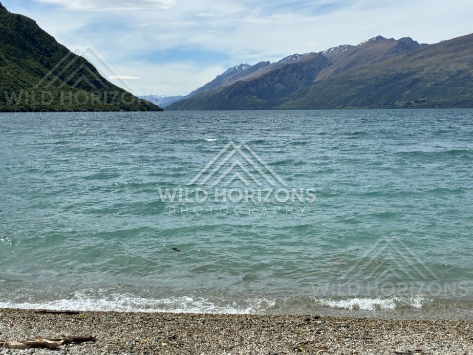 Lakeshore and mountain ridges in clear light. Kingston, New Zealand.