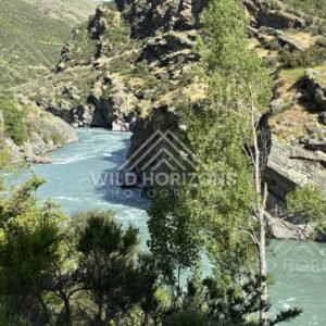 Turquoise river winding through rocky gorge. Kawarau River, New Zealand.
