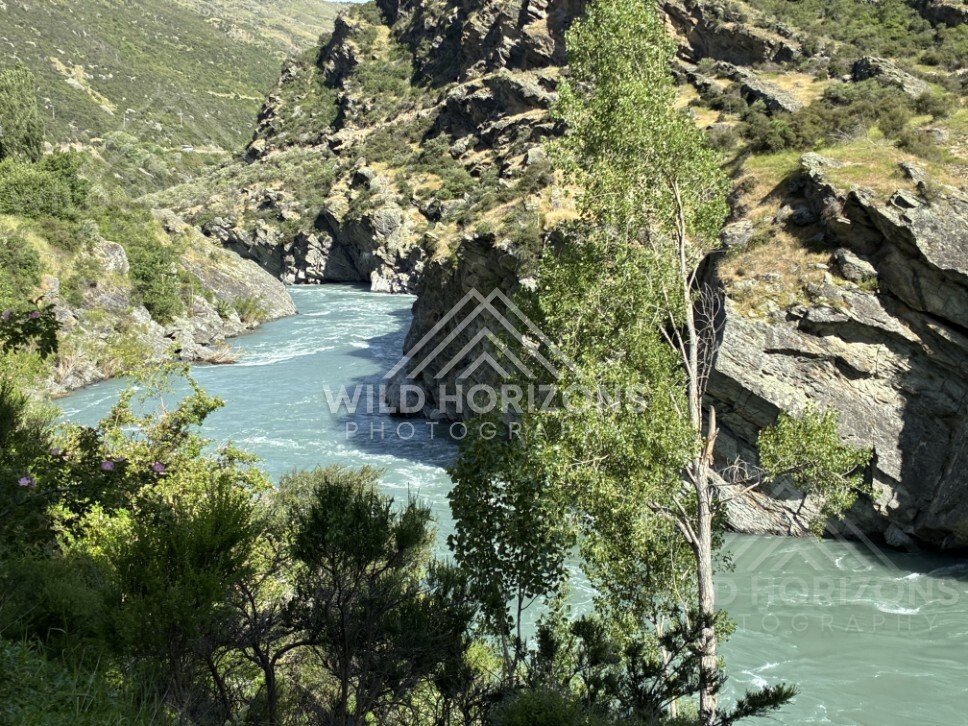 Turquoise river winding through rocky gorge. Kawarau River, New Zealand.