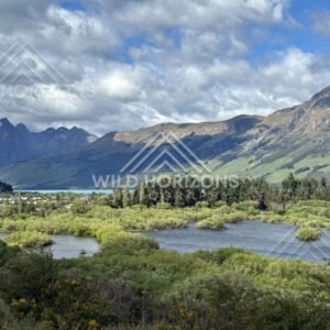 Braided river and wetland with mountain backdrop. Glenorchy, New Zealand.
