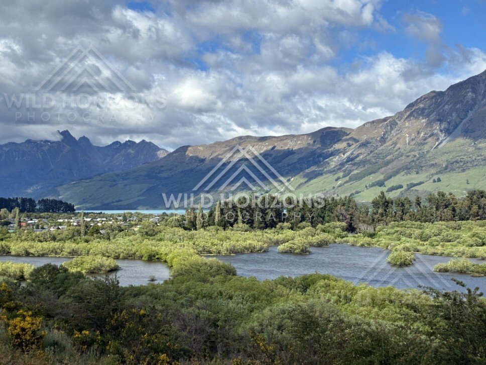 Braided river and wetland with mountain backdrop. Glenorchy, New Zealand.