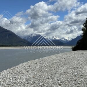 Rocky lakeshore with mountains and lake. Glenorchy, New Zealand.
