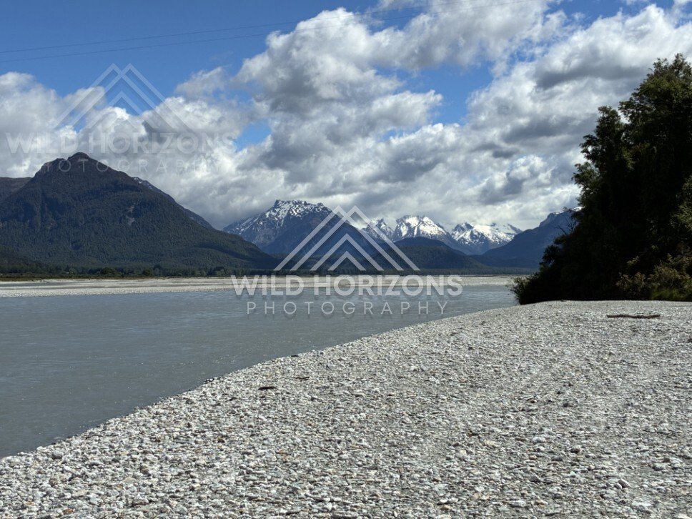 Rocky lakeshore with mountains and lake. Glenorchy, New Zealand.