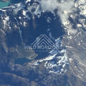Snow-covered alpine peaks seen from above. Queenstown, New Zealand.
