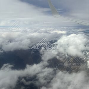 Aircraft wing above dense cloud cover. Queenstown, New Zealand.