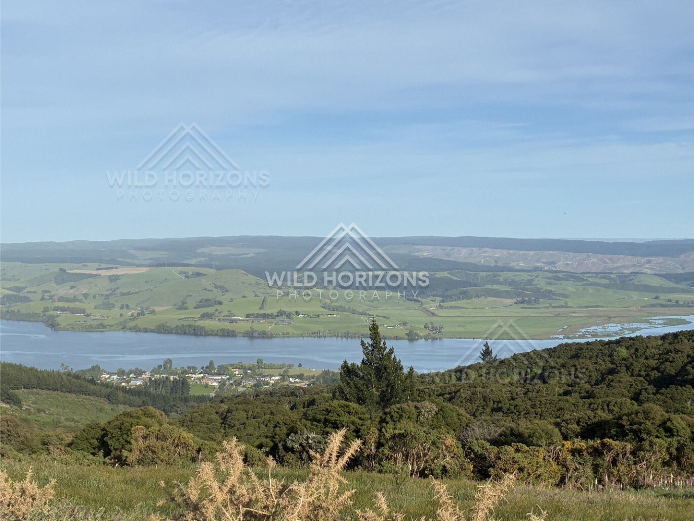 Wide view across farmland and distant hills. Waihola, New Zealand.