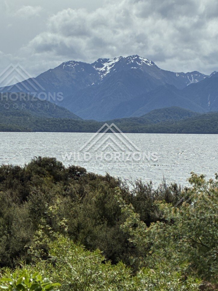 Mountain Peaks Above the Waters of Lake Te Anau. Te Anau, New Zealand.