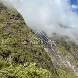Multi-Tier Waterfalls on a Rugged Alpine Slope. Milford Road, New Zealand.