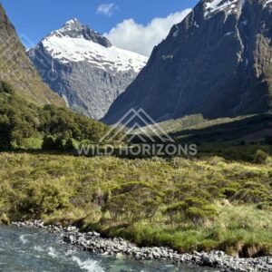 Valley River and Snowy Massif Between Steep Walls. Milford Road, New Zealand.