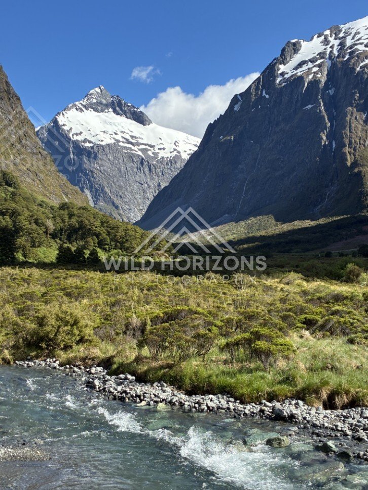 Valley River and Snowy Massif Between Steep Walls. Milford Road, New Zealand.