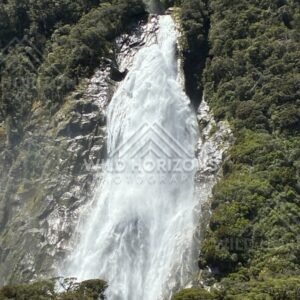 Stirling Falls Plunging Down a Forested Cliff. Milford Sound, New Zealand.