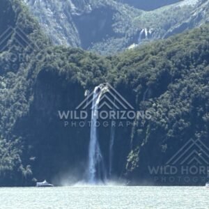 Tall Twin Waterfalls Framed by Steep Fiord Walls. Milford Sound, New Zealand.