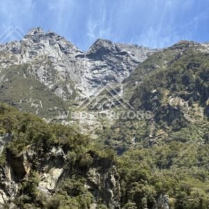Alpine Peaks with Cascading Stream Down a Mountain Gully. Milford Sound, New Zealand.