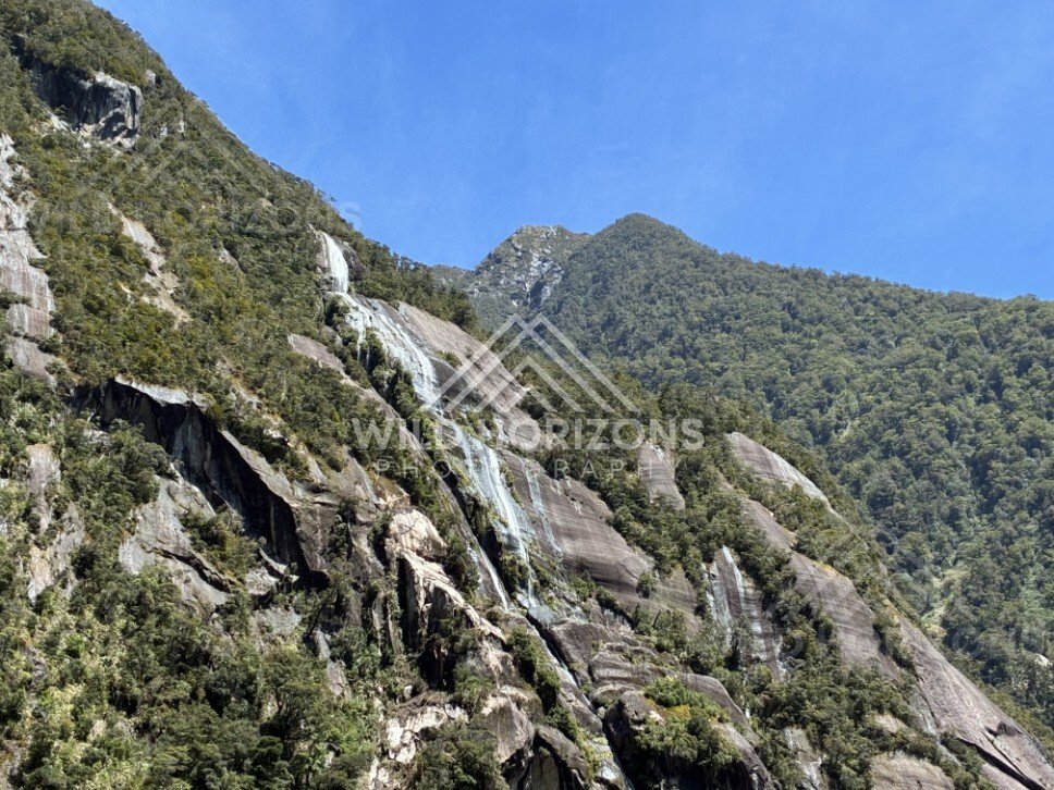 Waterfalls Sliding Over Granite Slabs on a Steep Slope. Milford Sound, New Zealand.