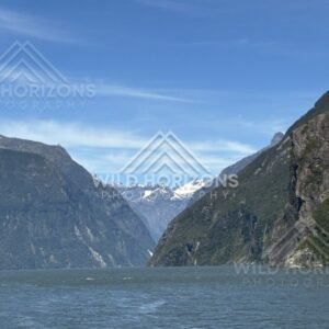 Milford Sound Waterway Framed by Cliffs and Snowy Peaks. Milford Sound, New Zealand.