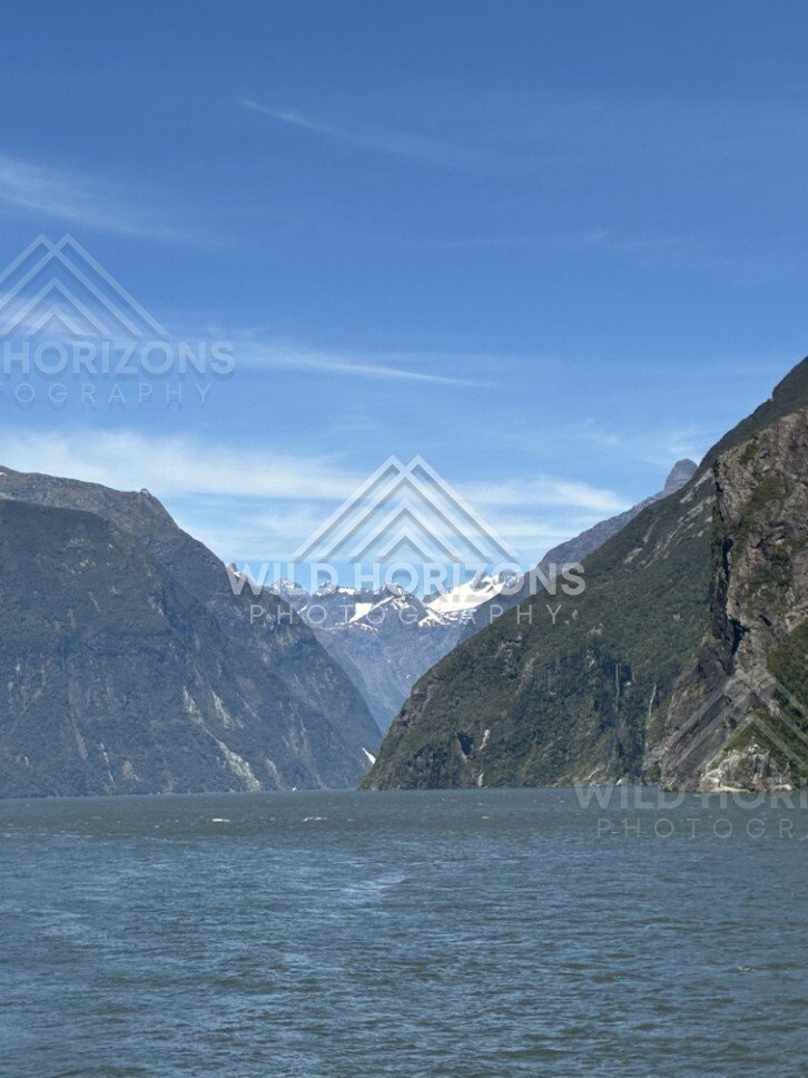 Milford Sound Waterway Framed by Cliffs and Snowy Peaks. Milford Sound, New Zealand.