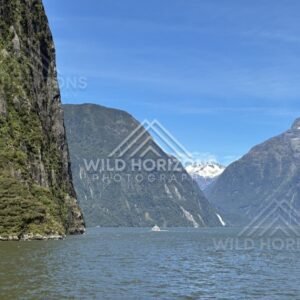 Wide Milford Sound Scene with Distant Boat on the Water. Milford Sound, New Zealand.