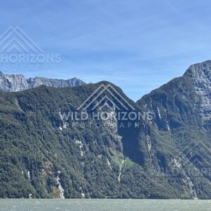 Steep Mountain Wall Rising Above a Remote Fiord Landscape. Milford Sound, New Zealand.