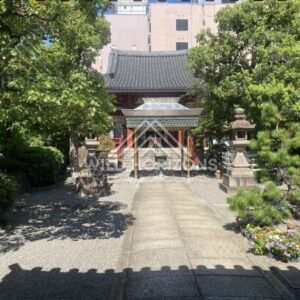 Stone Lanterns Framing a Small Temple Courtyard. Osaka, Japan.