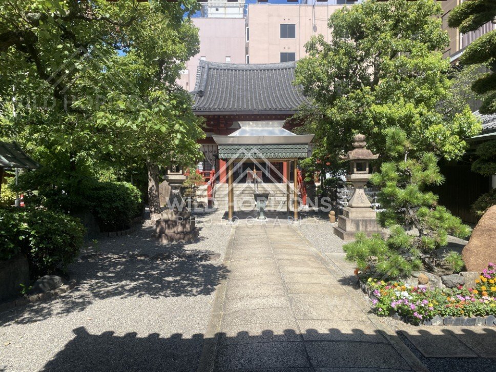Stone Lanterns Framing a Small Temple Courtyard. Osaka, Japan.
