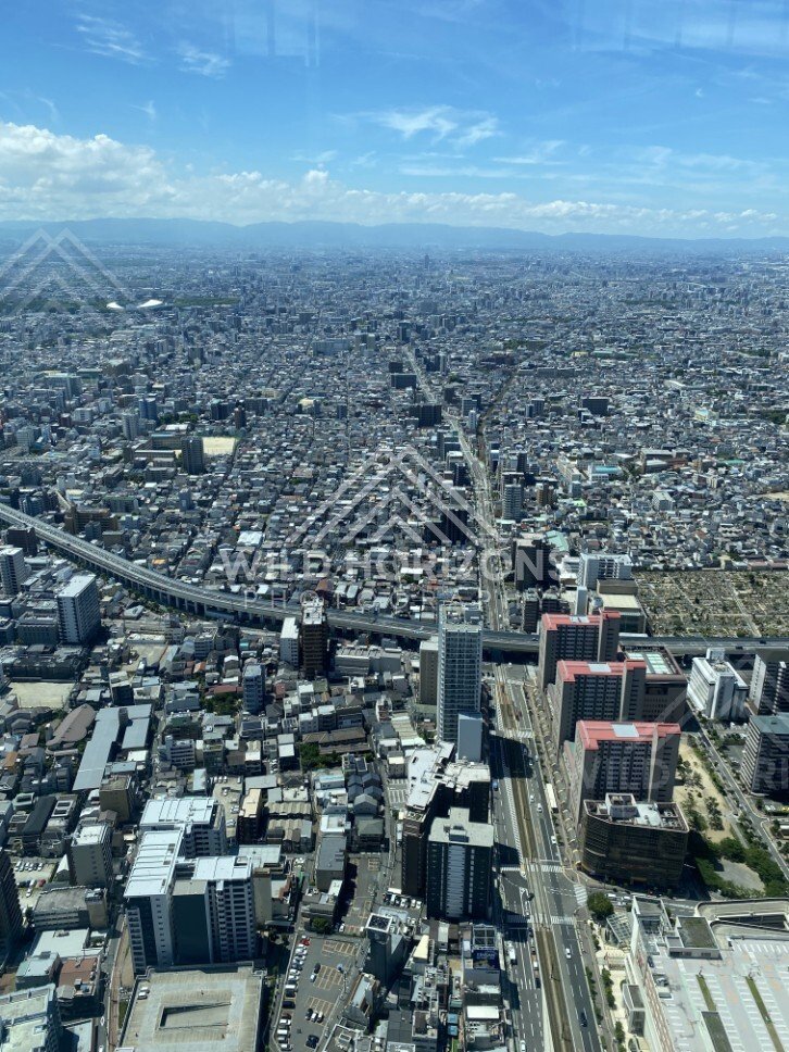 High-Angle View Down a Major Osaka Boulevard with Elevated Roads and Rails. Umeda Sky Building, Osaka, Japan.