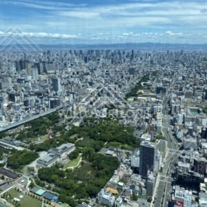 Osaka Cityscape with a Large Green Park Framed by High-Rise Buildings. Umeda Sky Building, Osaka, Japan.