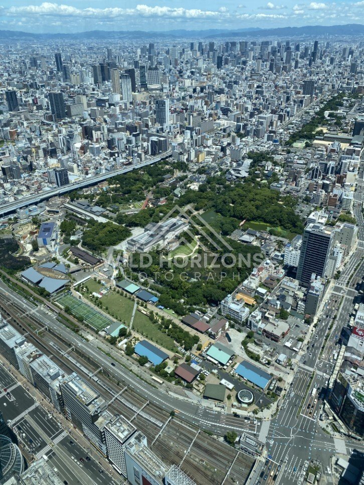 Aerial View of Central Osaka with Parkland and Rail Lines. Umeda Sky Building, Osaka, Japan.