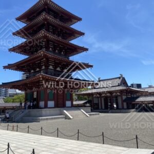 Five-Story Pagoda Rising Above a Wide Gravel Courtyard in Bright Sun. Shitennoji Temple, Osaka, Japan.