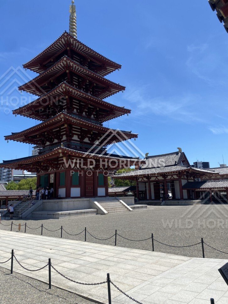 Five-Story Pagoda Rising Above a Wide Gravel Courtyard in Bright Sun. Shitennoji Temple, Osaka, Japan.