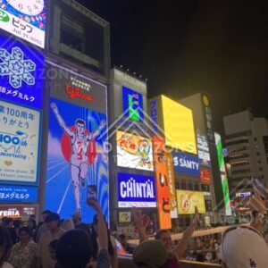 The iconic Glico sign and night crowds in Osaka’s entertainment district. Dotonbori, Osaka, Japan.