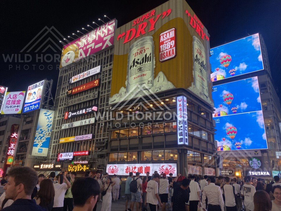 Towering billboards and packed streets in Osaka at night. Dotonbori, Osaka, Japan.